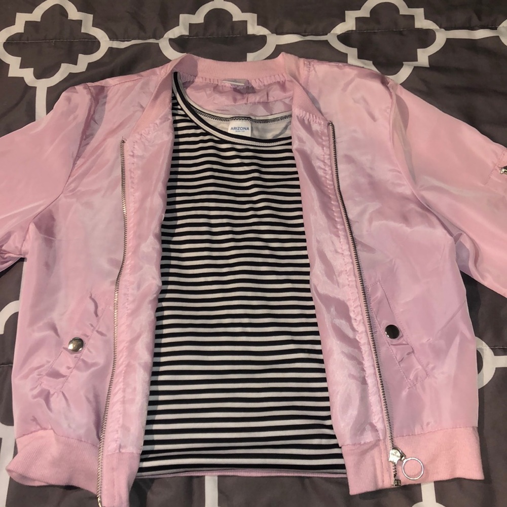 pink jacket with black and white striped tank top